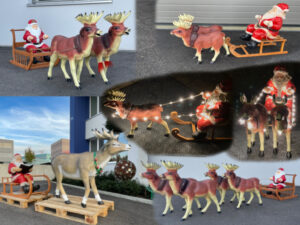Rentier mit Schlitten und Weihnachtsmann